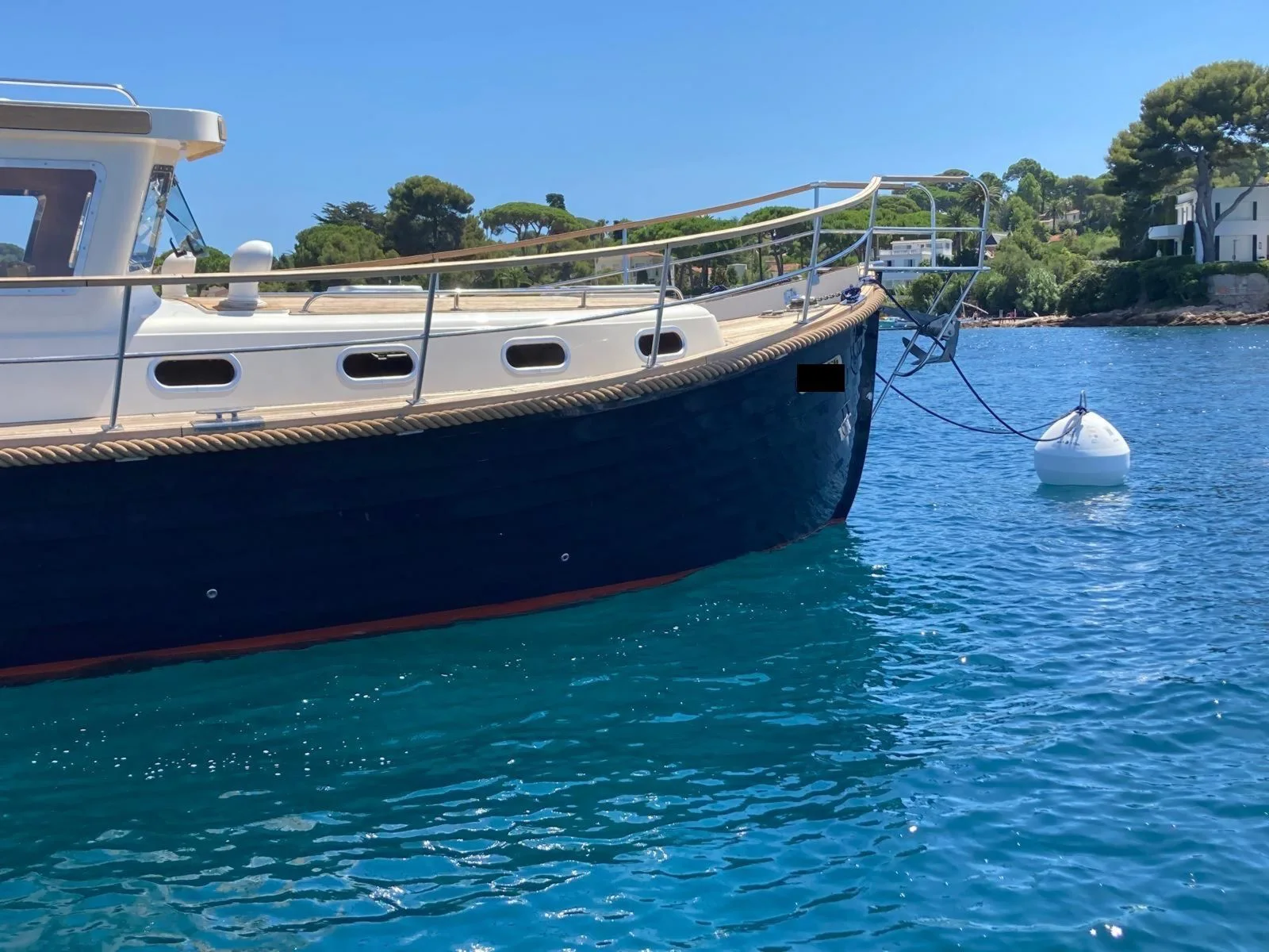 Boat moored to a mooring buoy at Cap d’Antibes.