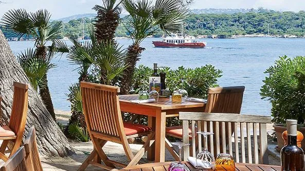 Restaurant terrace with a sea view in the Baie de Cannes.